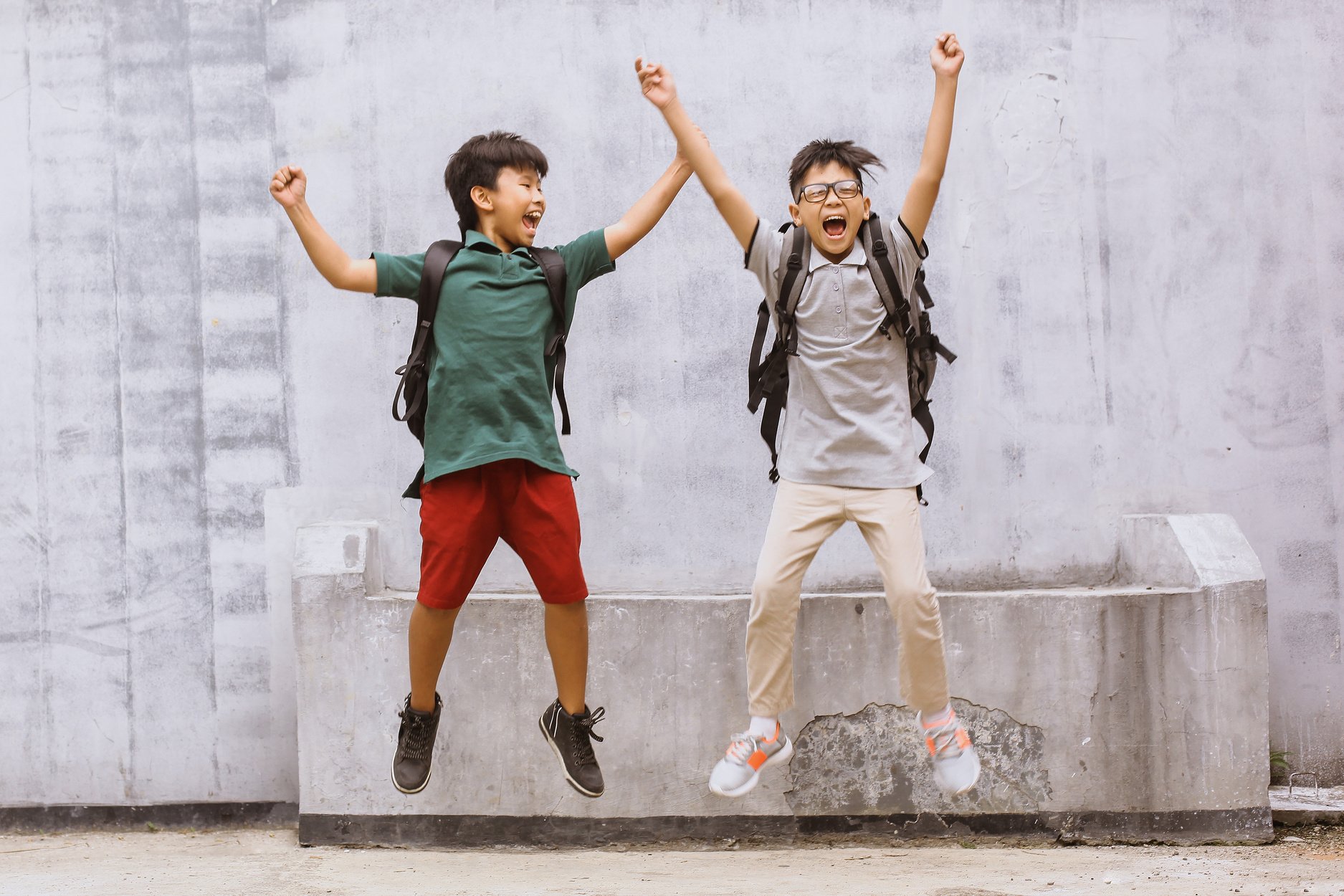 Two Happy Elementary School Students Welcome Back to School